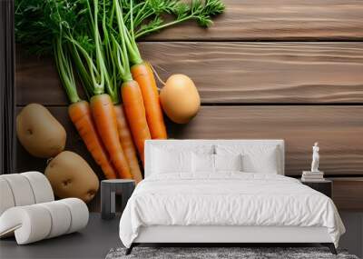 Harvested carrots and potatoes displayed on a rustic wooden table with straw, celebrating the essence of farm-fresh produce and healthy eating Wall mural