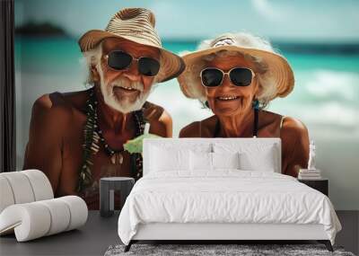 Joyful retired couple enjoying cocktails on the beach, soaking up the sun and relishing their travel adventures Wall mural