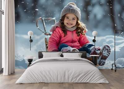 Joyful ride through winter wonderland with a smiling girl on a sleigh in the snow Wall mural