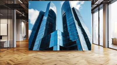 Modern skyscraper in Tbilisi showcasing geometric facade with reflective glass windows under a clear blue sky Wall mural