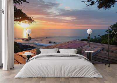 Peaceful yoga deck by the ocean at sunrise, ideal for meditation and tranquility Wall mural