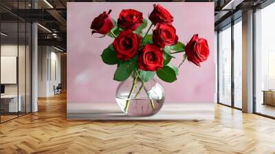 Romantic bouquet of red roses in a glass vase against a soft pastel pink backdrop, evoking love and passion, perfect for special occasions with a retro 90s vibe Wall mural