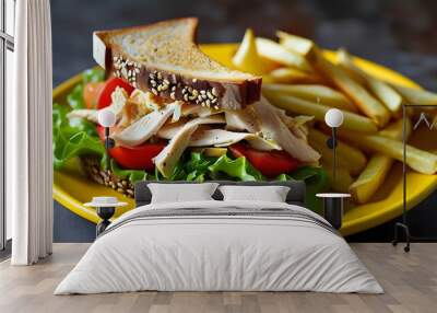 Savory chicken salad sandwich on multigrain bread with fresh lettuce, tomatoes, and crispy chips on a vibrant yellow plate Wall mural