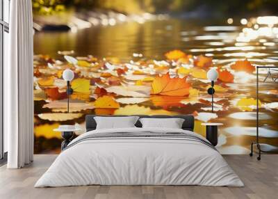 Serene autumn stream adorned with floating leaves in vibrant fall colors Wall mural