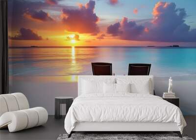 Serene sunset on a white sandy beach with two empty chairs in the Maldives Wall mural