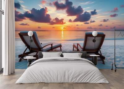 Serene sunset on a white sandy beach with two empty chairs in the Maldives Wall mural