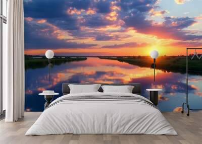 Serene sunset reflections on a tranquil river with a sky adorned by clouds Wall mural