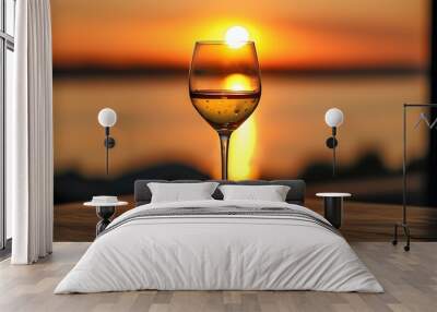 Serene Sunset with a Wine Glass Resting on a Table Wall mural