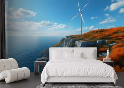 Solitary wind turbine towering over tranquil ocean and rugged cliffs, framed by brilliant orange foliage beneath a clear blue sky Wall mural