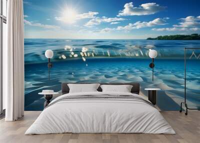 Underwater tranquility with shimmering sand, a vibrant blue ocean, and sunlit ripples creating a serene summer atmosphere Wall mural