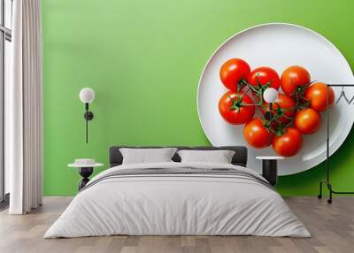 Vibrant display of fresh ripe tomatoes on a white plate amidst a lively green backdrop, perfect for culinary promotions and cookbook visuals Wall mural