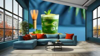 Vibrant green matcha martini on a striking blue backdrop, capturing the essence of a trendy summer refreshment for banners and posters Wall mural