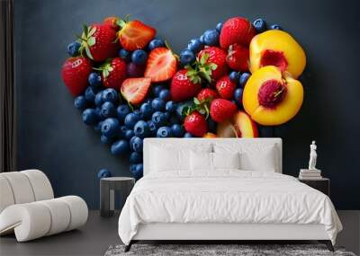 Vibrant heart-shaped display of fresh blueberries, strawberries, and peaches Wall mural