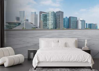 Empty Plaza floor tiles and the skyline of modern urban buildings in Hangzhou.. Wall mural