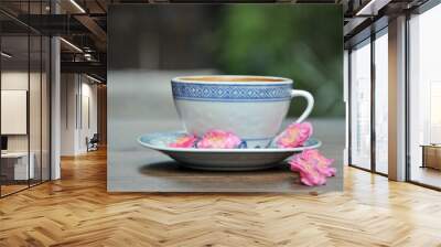 cup of coffee and plum flowers on the table Wall mural