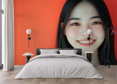 Positive female smiling on solid background Wall mural