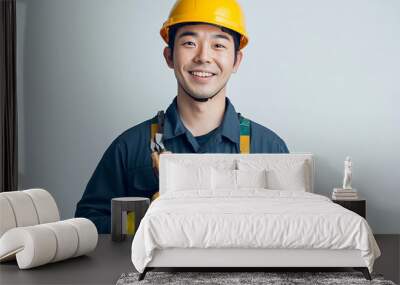 Worker wearing hard hat smiling positively Wall mural