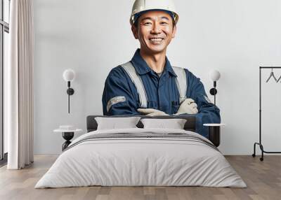 Worker wearing hard hat smiling positively Wall mural