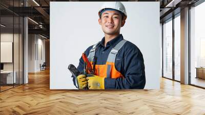 Worker wearing hard hat smiling positively Wall mural