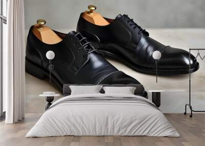 Elegant black leather shoes for men featuring classic design and refined shoelaces Wall mural