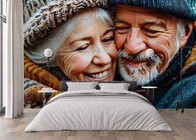 Joyful elder couple embracing in warm attire, capturing the essence of love and companionship in a heartfelt close-up portrait Wall mural