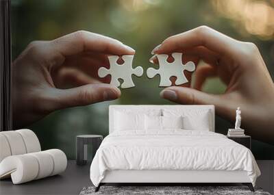 A pair of hands put two pieces of the puzzle together Wall mural