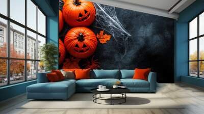 Halloween pumpkins with spider web on a dark background Wall mural