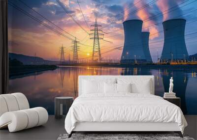 Nuclear power plant with two towers, glowing in the dusk light near river and highvoltage lines Wall mural