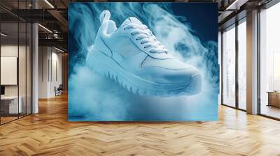 White sneaker with a thick sole, surrounded by swirling smoke on a blue background Wall mural