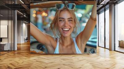 Joyful European woman celebrating successful car purchase, gesturing YES and shouting, sitting inside auto Wall mural