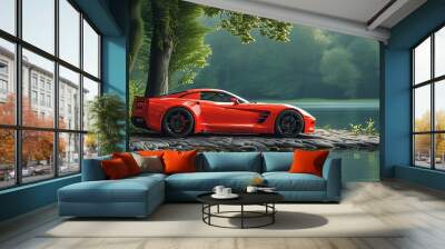 A bright red sports car is parked at the water's edge, surrounded by lush trees. The scenery is peaceful and beautiful, showing a unique atmosphere that combines nature and modernity. Wall mural