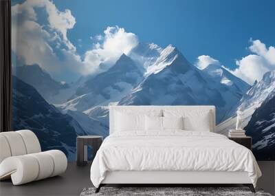 A mountain range covered with snow, blue sky and white clouds complement each other, presenting a tranquil and spectacular natural scenery Wall mural