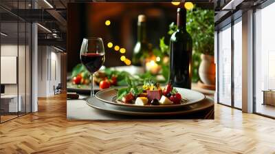 A plate of exquisite food is placed on the table, paired with red wine bottles and green plants, and the warm lights create a romantic atmosphere Wall mural