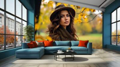 Autumn park beauty, female fashion portrait, natural charm in yellow leaves flying. Wall mural