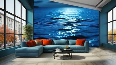 In the deep blue ocean, the water surface exudes a faint light, a mysterious and peaceful scene. Wall mural