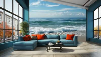 The calm and vast ocean meets the sky, and the waves gently beat the beach, presenting a peaceful and harmonious natural scene. Wall mural