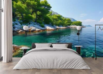 The quiet coastline, clear sea water meets rocks, surrounded by green trees, showing the harmonious and beautiful scenery of nature. Wall mural