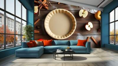 The simple kitchen table with empty pie plates and chopped apples, surrounded by cinnamon sticks and sugar creates a warm baking atmosphere. Wall mural