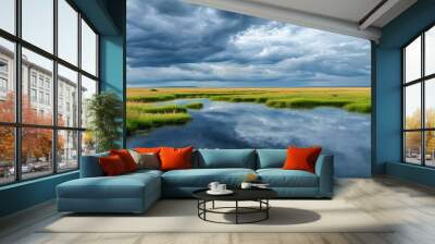 The vast grassland and the cloudy sky interweave into a tranquil natural picture, showing the majesty and tranquility of nature. Wall mural