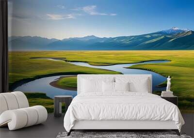 The vast grasslands and winding mountains complement each other in the sun, showing a beautiful scene of tranquility and nature. Wall mural