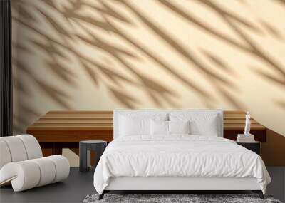 Empty wood table top on beige wall texture with tree leaves shadow background Wall mural