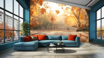 Wooden table with an autumn background and blurred golden-yellow bokeh light, with falling leaves in the air Wall mural