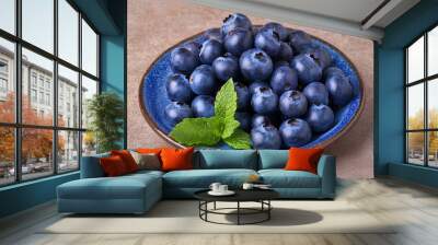 blueberries in a bowl on table Wall mural