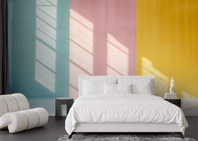 Pastel colored serene empty background, with sunlight streaming in, creating soft shadows and gradients, a wall divided into three vertical sections of pastel colors—light blue, pink, and yellow Wall mural