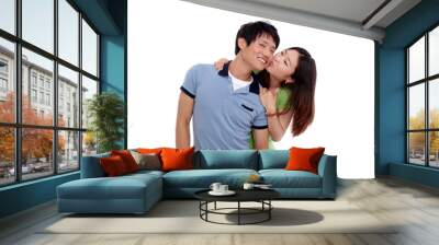 Happy couple hugging and kissing over white background Wall mural