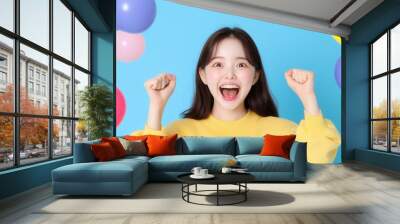 Excited young asian female with raised hands celebrating success Portrait cheerful positive asian woman with raised hands and fists open mouth Girl get happy, enjoy life isolated on blue copy space Wall mural